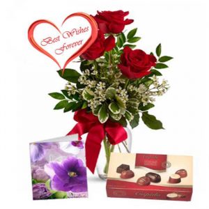 Three red roses with chocolate