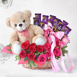 Assorted Roses With Dairy Milk Teddy In Basket